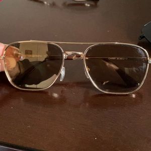 Gold frame sunglasses